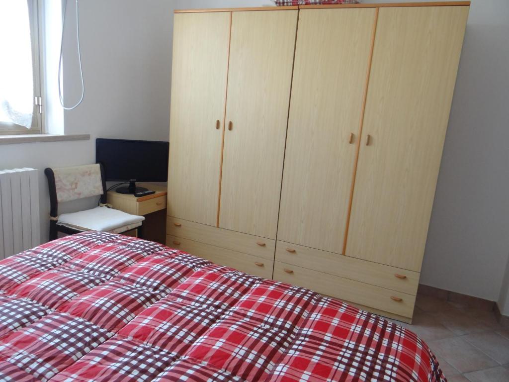 Postel nebo postele na pokoji v ubytování Villetta in collina a due passi dal mare