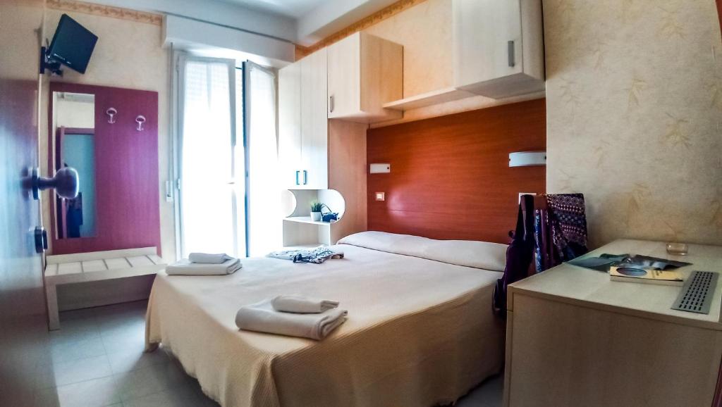 Postel nebo postele na pokoji v ubytování Hotel Condor