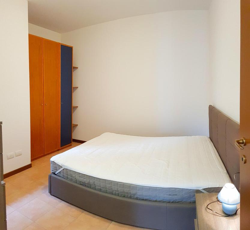 Posteľ alebo postele v izbe v ubytovaní La Quiete 19 Lake view apartment by Gardadomusmea