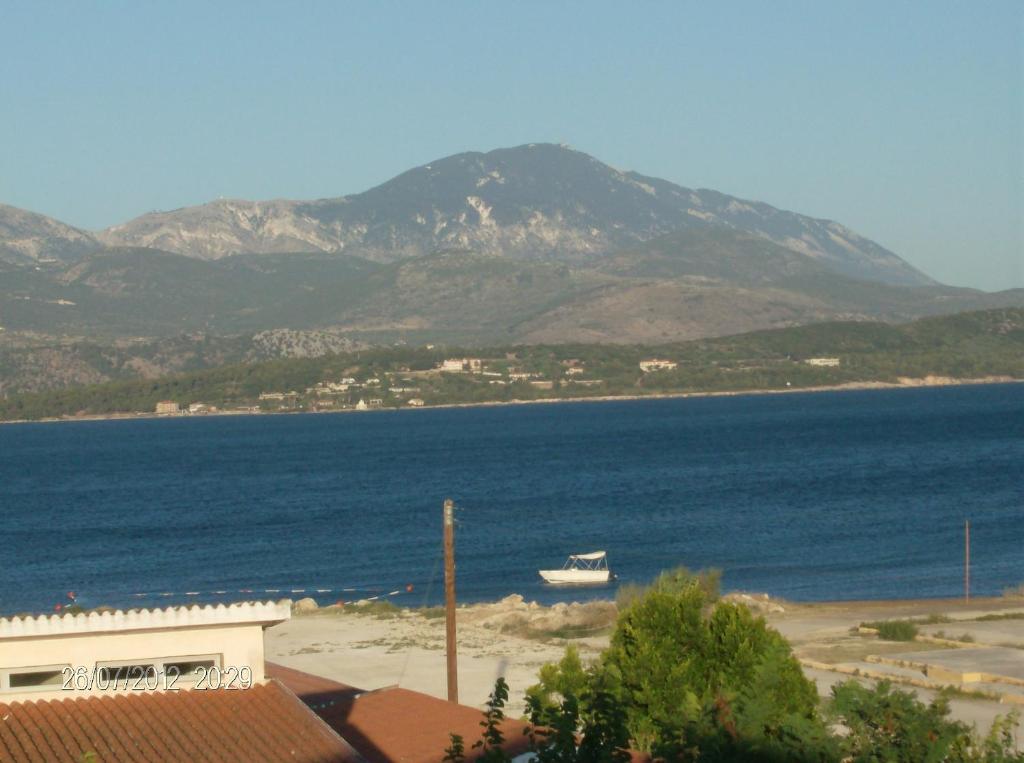 a view of a large body of water with mountains at Sunny Beutiful Apartment in Lixouri