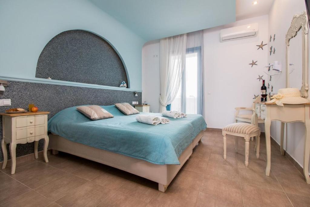 Postel nebo postele na pokoji v ubytování Michaella Studios