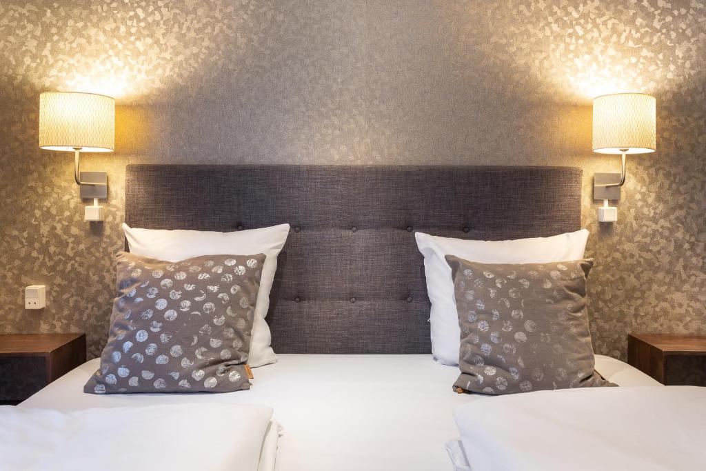 Postel nebo postele na pokoji v ubytování Hotel Tiffany