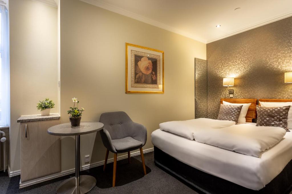 Postel nebo postele na pokoji v ubytování Hotel Tiffany