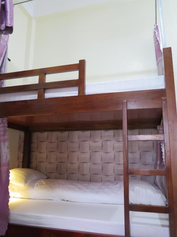 Postel nebo postele na pokoji v ubytování Ha Giang 1 Hostel and Loop Tour