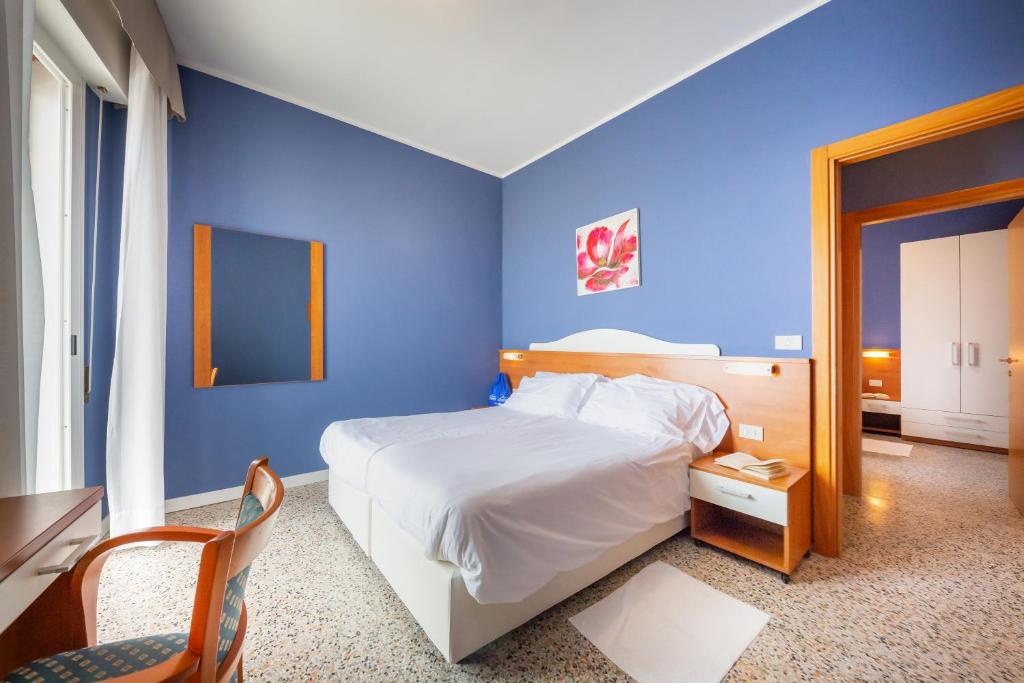 Postel nebo postele na pokoji v ubytování Hotel Verona