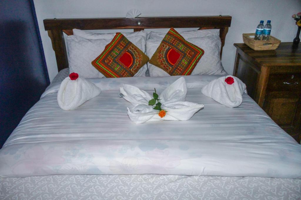 Posteľ alebo postele v izbe v ubytovaní Sinzia Villas