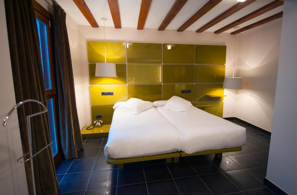 Posada del León de Oro Boutique Hotelにあるベッド