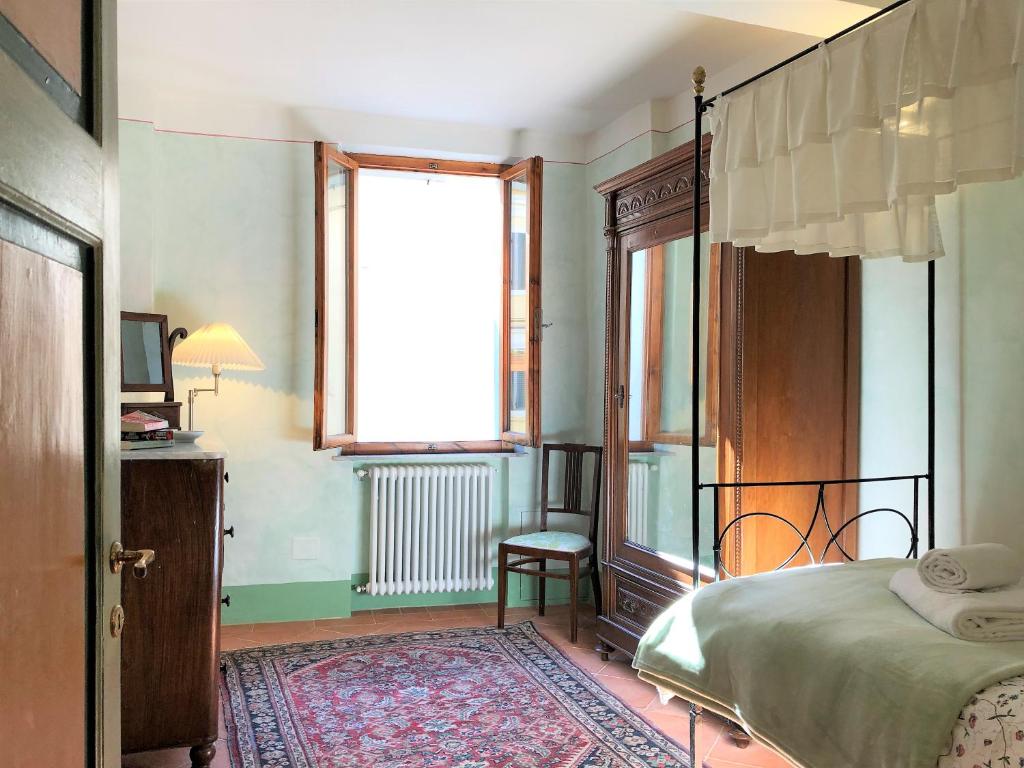 Posteľ alebo postele v izbe v ubytovaní SIENA ROMANTIC EXPERIENCE