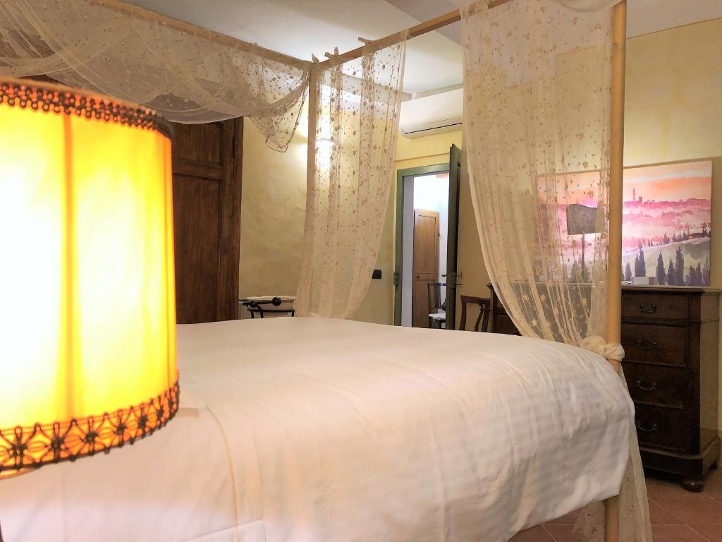 Posteľ alebo postele v izbe v ubytovaní SIENA ROMANTIC EXPERIENCE