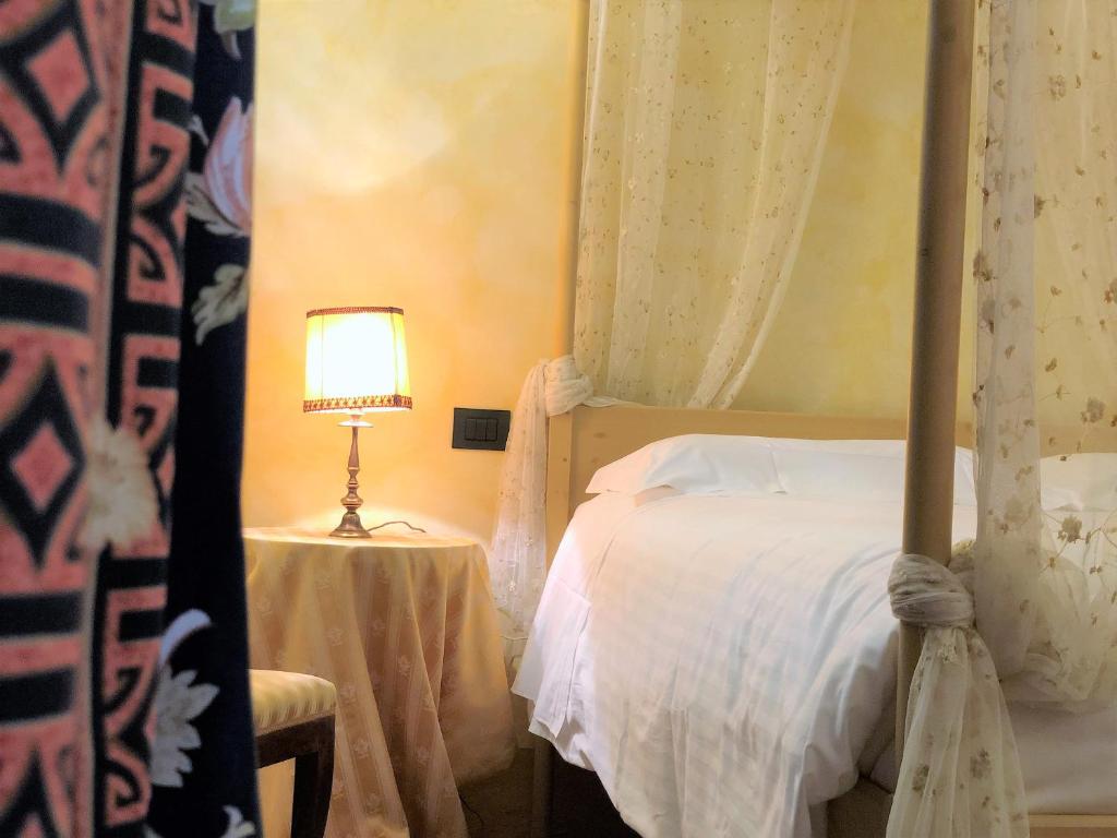 Posteľ alebo postele v izbe v ubytovaní SIENA ROMANTIC EXPERIENCE