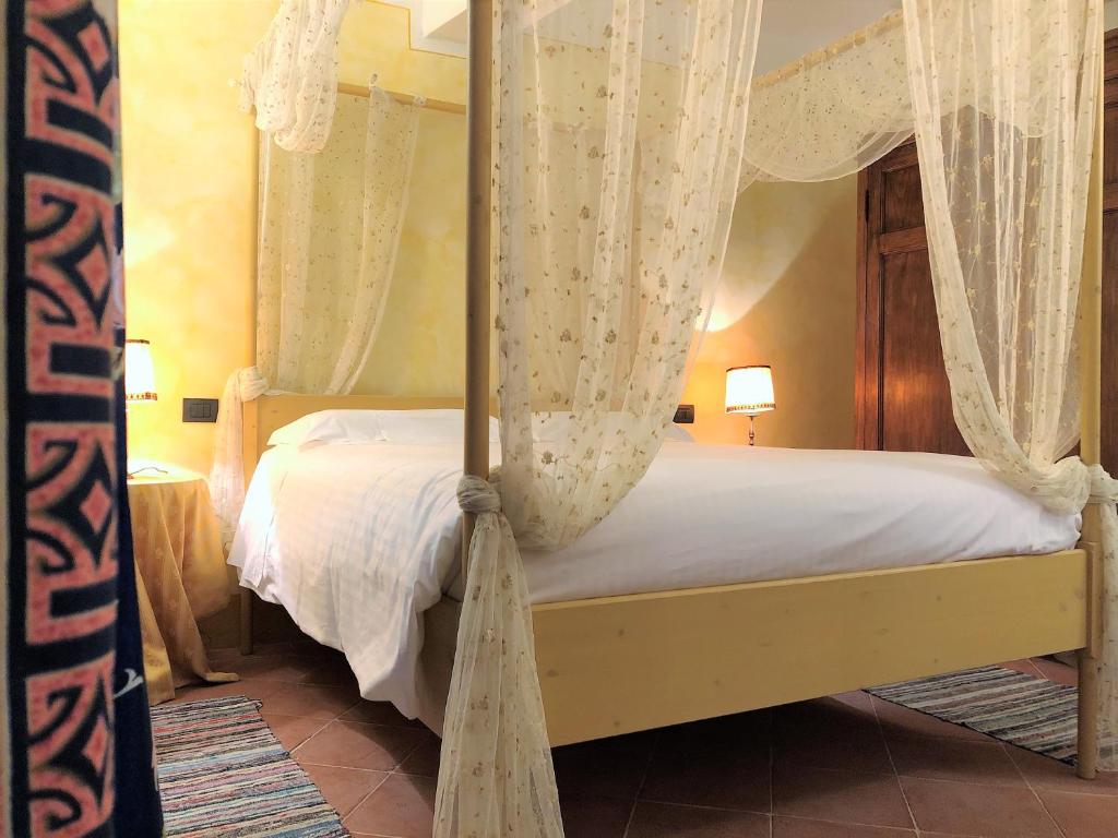 Posteľ alebo postele v izbe v ubytovaní SIENA ROMANTIC EXPERIENCE