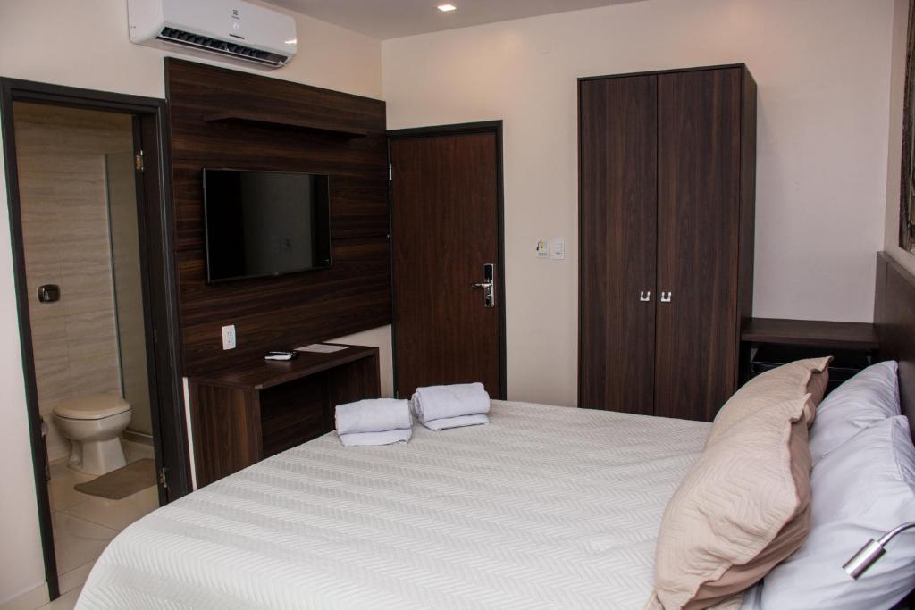 Postel nebo postele na pokoji v ubytování SERPYL Plaza Hotel