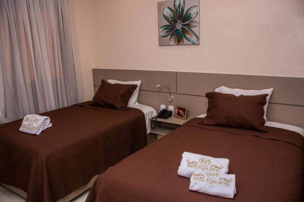 Postel nebo postele na pokoji v ubytování SERPYL Plaza Hotel