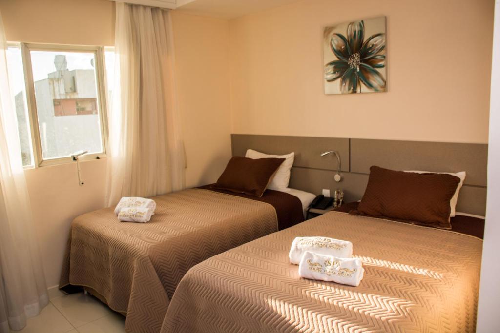 Postel nebo postele na pokoji v ubytování SERPYL Plaza Hotel