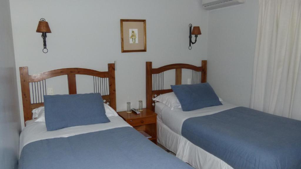 Uma cama ou camas num quarto em Hostal Cepa Noble