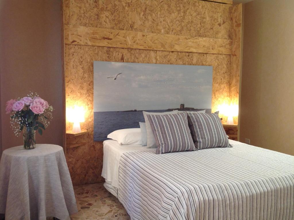 Postel nebo postele na pokoji v ubytování Mare Nostrum Petit Hôtel