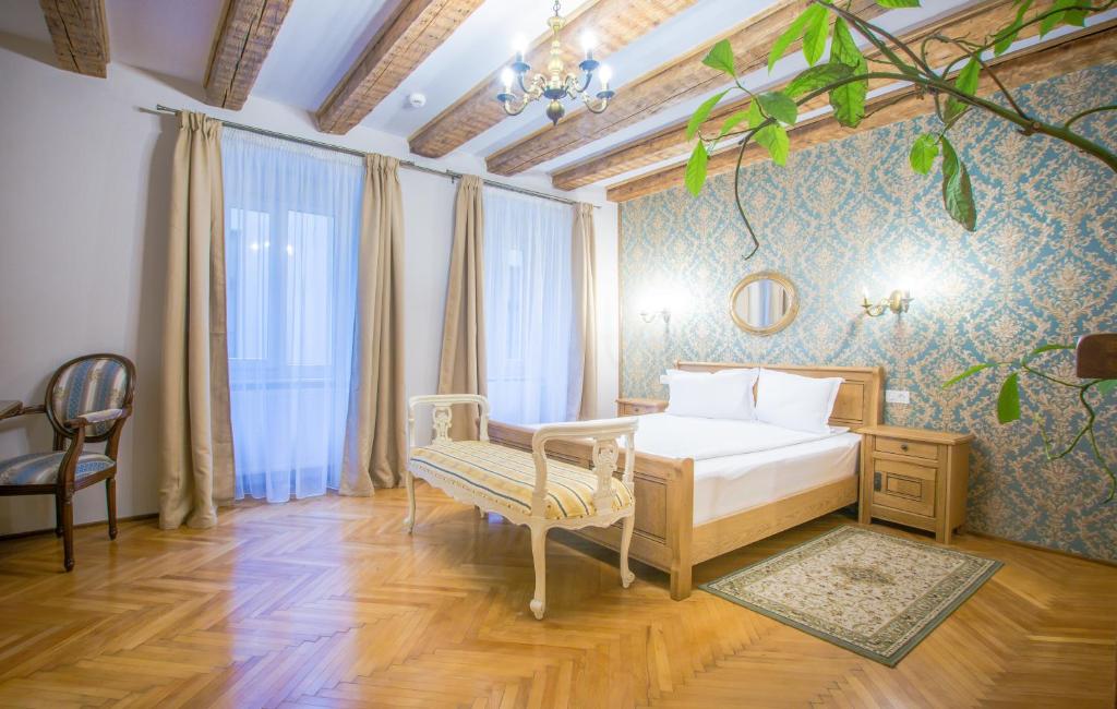 Postel nebo postele na pokoji v ubytování Safrano Palace