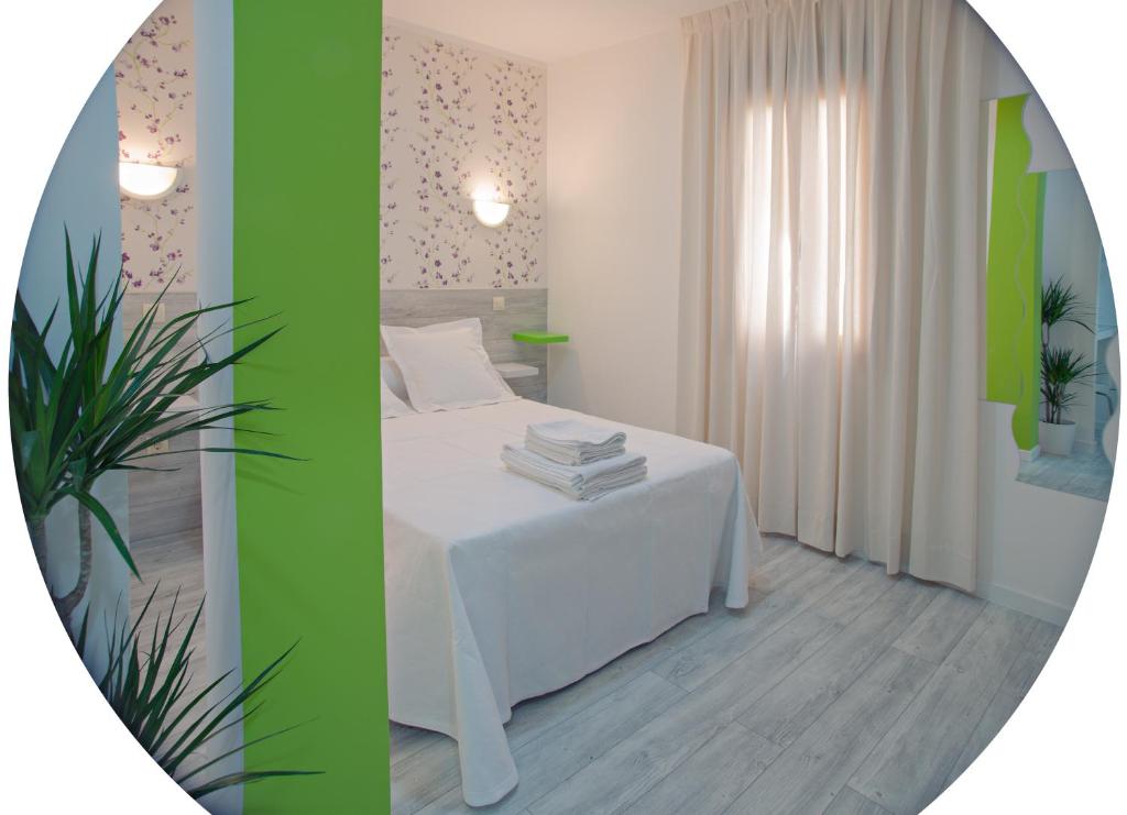 Una cama o camas en una habitación de Nersan