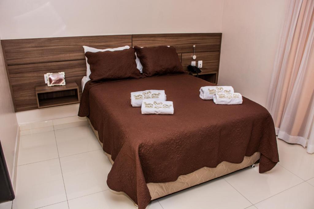 Postel nebo postele na pokoji v ubytování SERPYL Plaza Hotel
