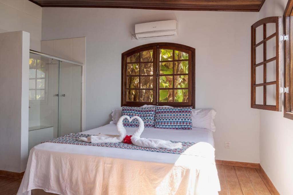 Cama ou camas em um quarto em Pousada Toca do Mar