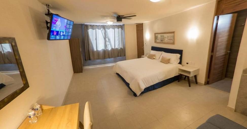 Postel nebo postele na pokoji v ubytování Hotel Siena