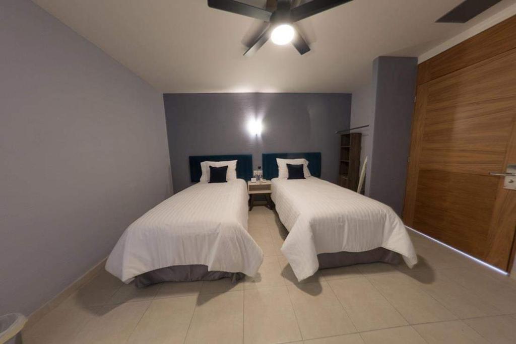 Postel nebo postele na pokoji v ubytování Hotel Siena