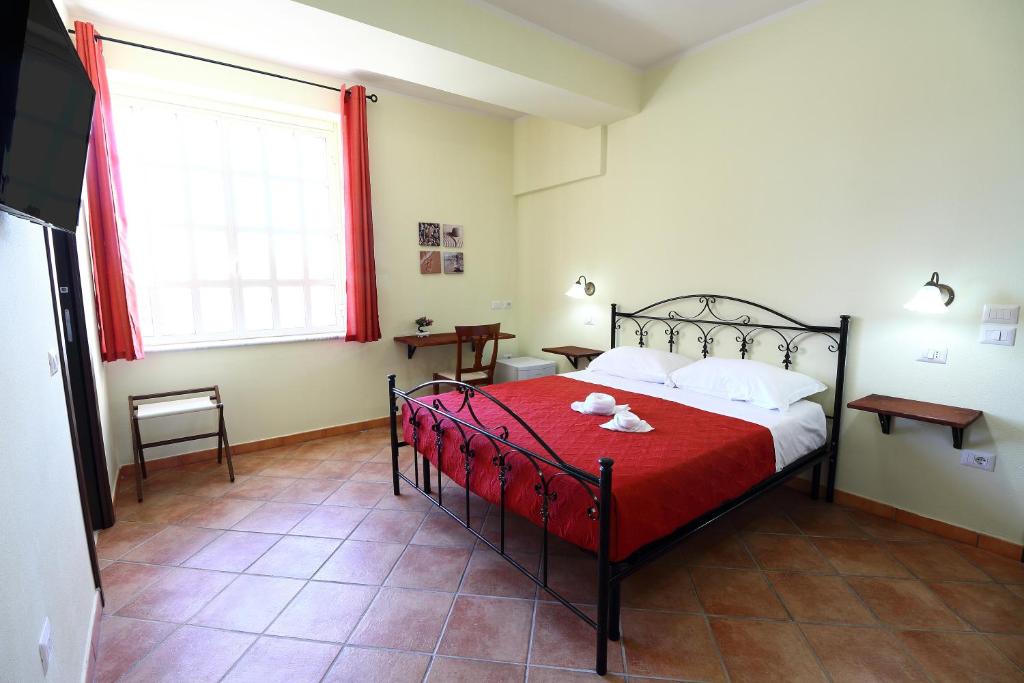 Ένα ή περισσότερα κρεβάτια σε δωμάτιο στο Guest House Capitan Libeccio