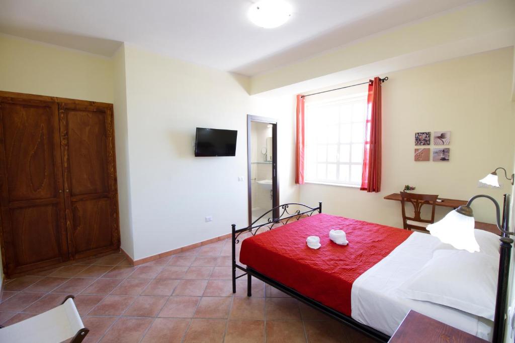 Letto o letti in una camera di Guest House Capitan Libeccio