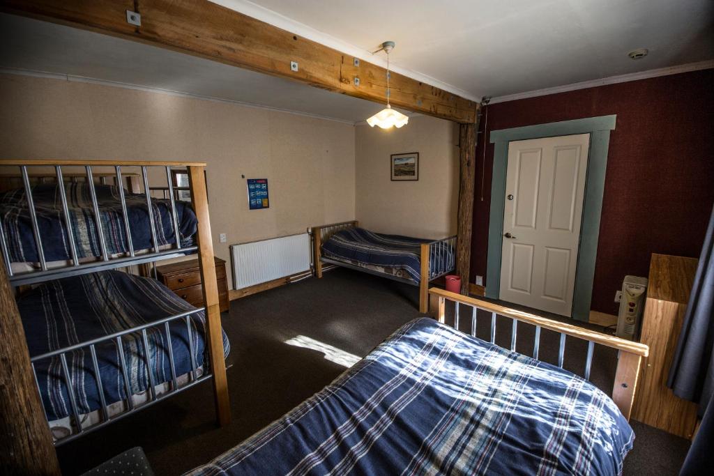 Postel nebo postele na pokoji v ubytování Smylies Accommodation