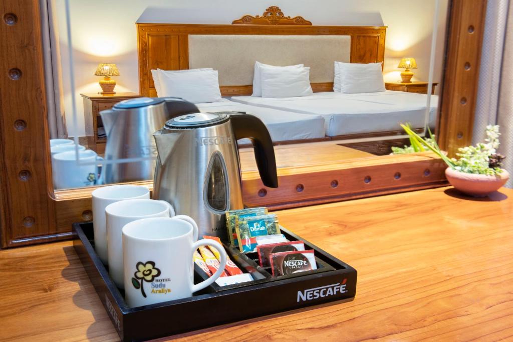 Postel nebo postele na pokoji v ubytování Hotel Sudu Araliya