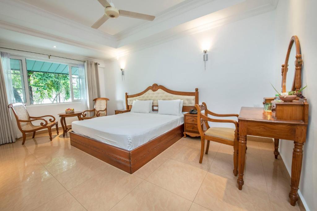 Postel nebo postele na pokoji v ubytování Hotel Sudu Araliya