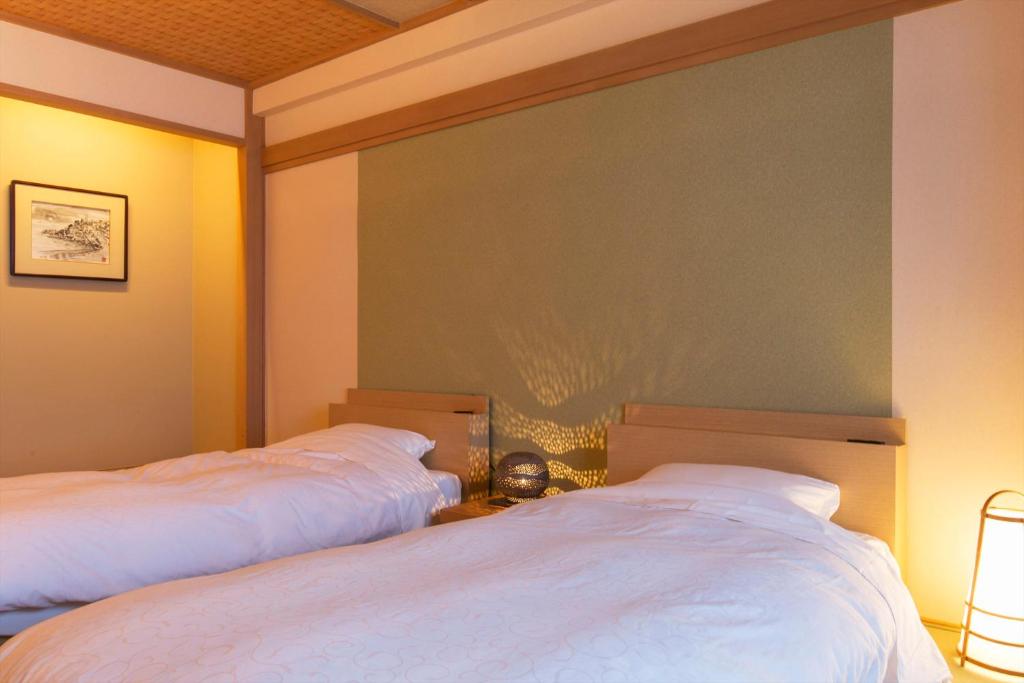 Una cama o camas en una habitación de Ito Kowakien