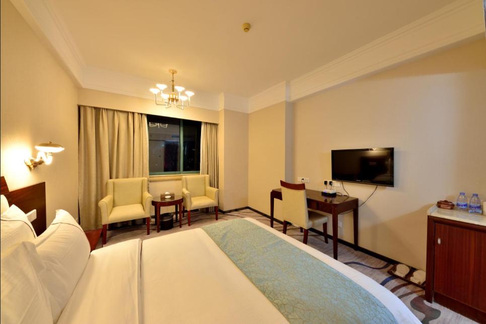Postel nebo postele na pokoji v ubytování Hai Jun Hotel Guangzhou Beijing Road Tianzi Wharf Store