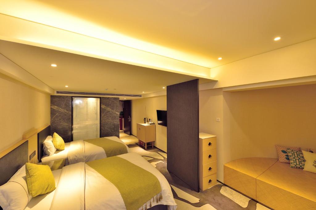 Postel nebo postele na pokoji v ubytování Hai Jun Hotel Guangzhou Beijing Road Tianzi Wharf Store