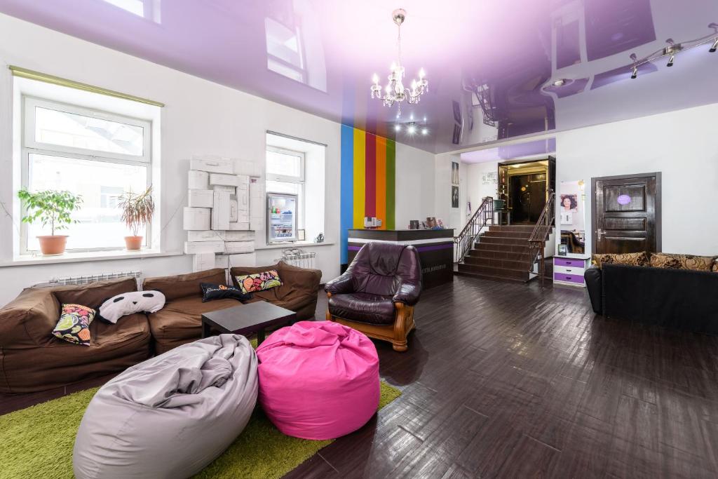 a large living room with a couch and a table at FunKey Hostel in Novosibirsk