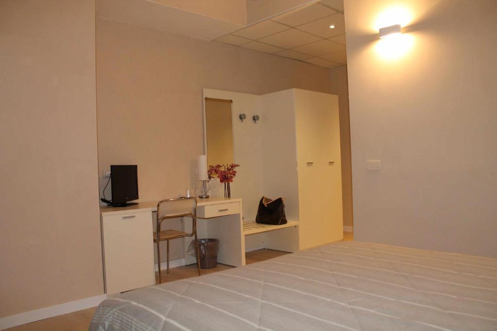 Postel nebo postele na pokoji v ubytování Hotel Cremona Viale