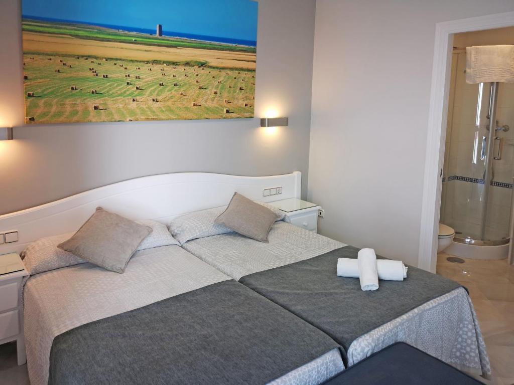 Posteľ alebo postele v izbe v ubytovaní Hostal Bodega