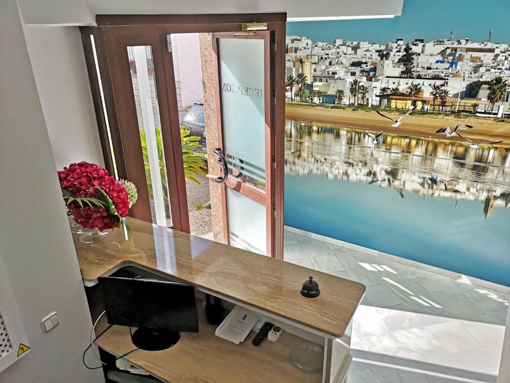Televízia a/alebo spoločenská miestnosť v ubytovaní Hostal Bodega