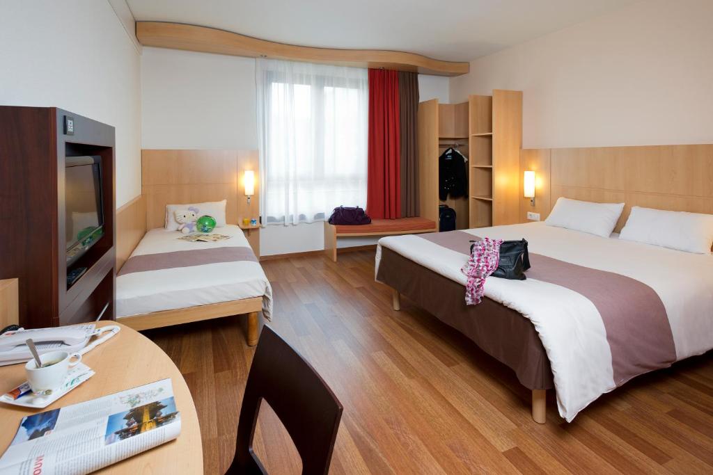 Postel nebo postele na pokoji v ubytování ibis Brussels Waterloo
