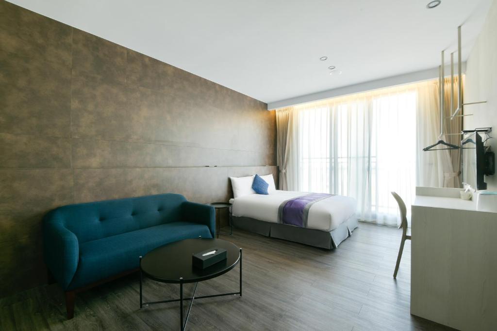 Postel nebo postele na pokoji v ubytování Hotel Hesper HSR Taichung