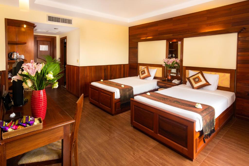 Postel nebo postele na pokoji v ubytování City River Hotel
