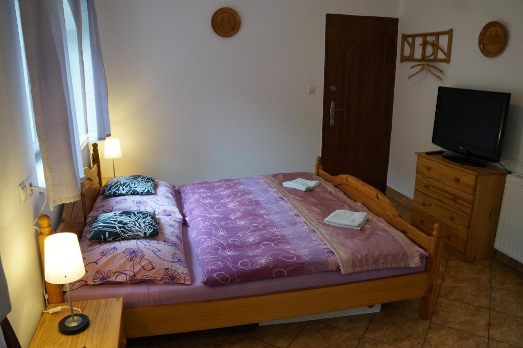 Postel nebo postele na pokoji v ubytování Penzion Kutil Trojanovice