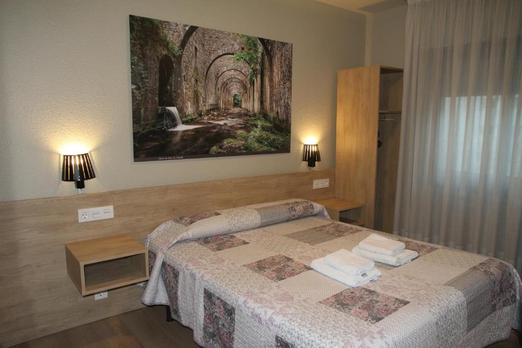 Postel nebo postele na pokoji v ubytování Hostal Acella