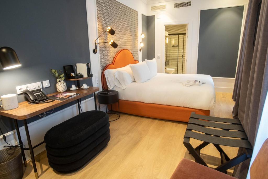 Posteľ alebo postele v izbe v ubytovaní Soho Boutique Opera