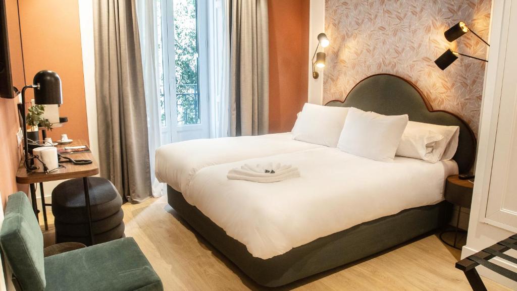 Posteľ alebo postele v izbe v ubytovaní Soho Boutique Opera