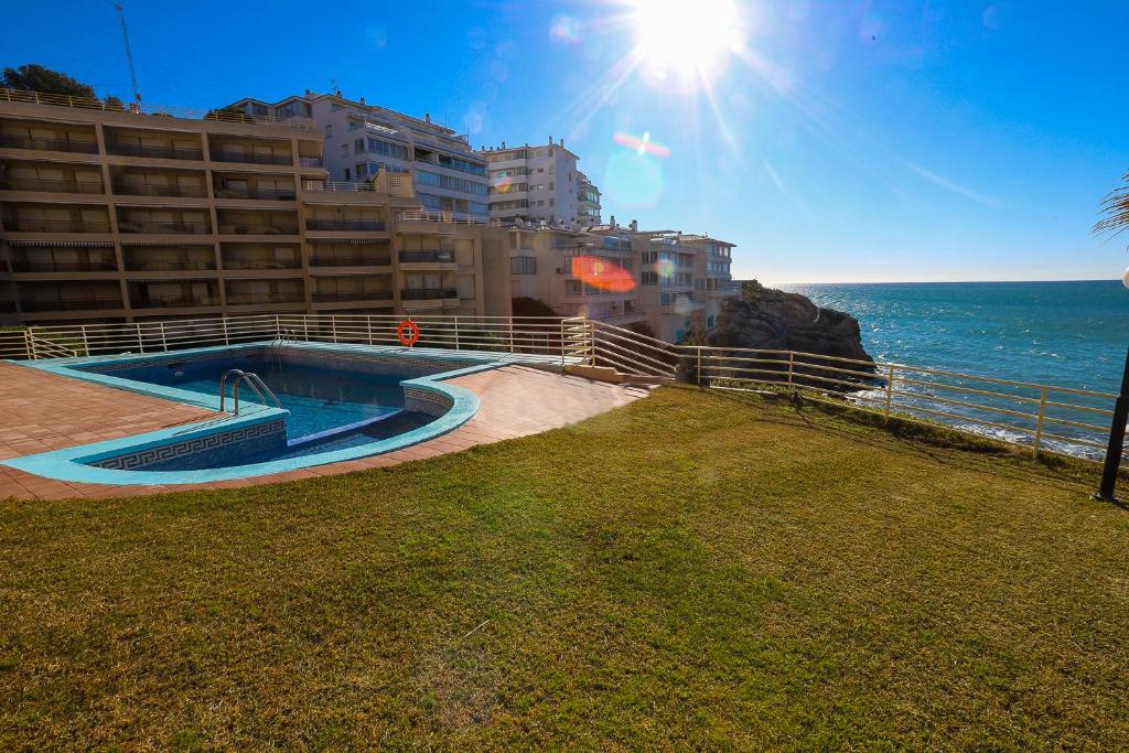 The swimming pool at or near DIFFERENTFLATS Cala Llenguadets