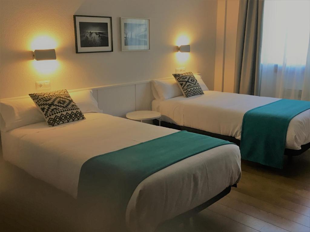 Postel nebo postele na pokoji v ubytování Hotel Elorrio