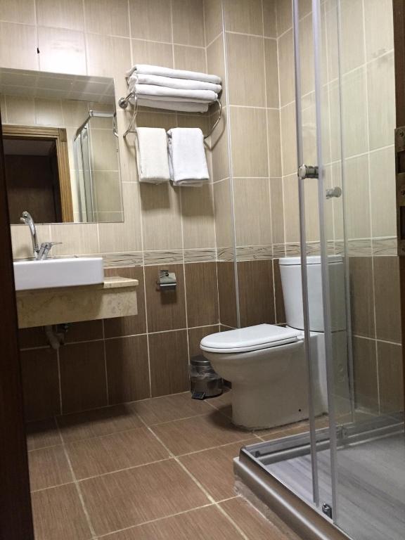A bathroom at Omega Luxx Hotel