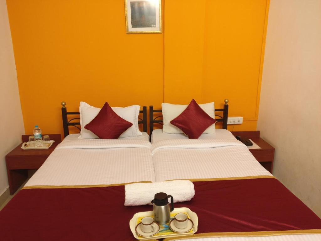 Postel nebo postele na pokoji v ubytování HMR Hotels - Hotel HMR Royal Inn