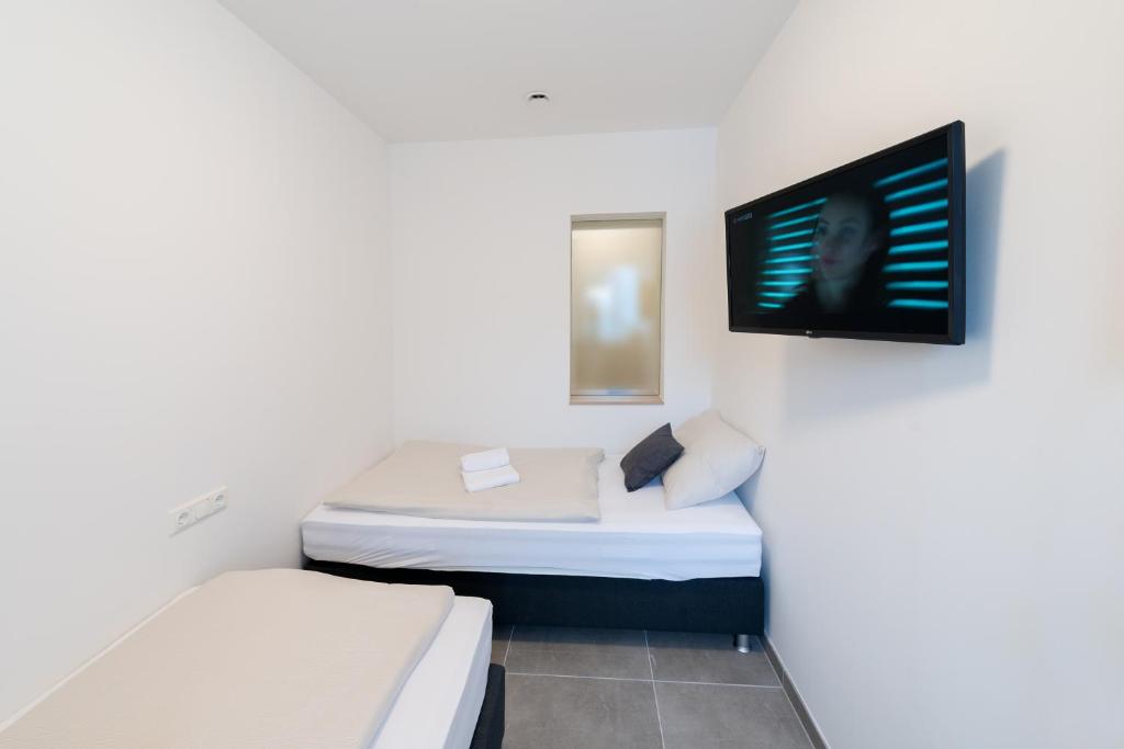 Postel nebo postele na pokoji v ubytování MOTEL24seven